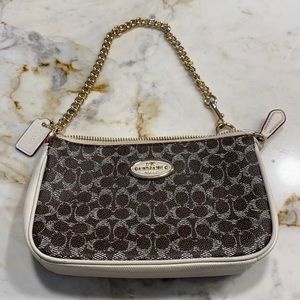 I am selling a coach purse brand new 8 x 5inches